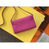 Let us introduce the Kelly Wallet to Go. The petite bag has the traditional Kelly wallet turn-clasp and sangles. The addition of a removable shoulder strap transforms this iconic style into a multi-functional piece - switch from a classic wallet to a crossbody bag in one fell swoop! - Image 2