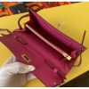 Let us introduce the Kelly Wallet to Go. The petite bag has the traditional Kelly wallet turn-clasp and sangles. The addition of a removable shoulder strap transforms this iconic style into a multi-functional piece - switch from a classic wallet to a crossbody bag in one fell swoop! - Image 4